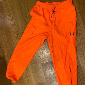 Orange track pants